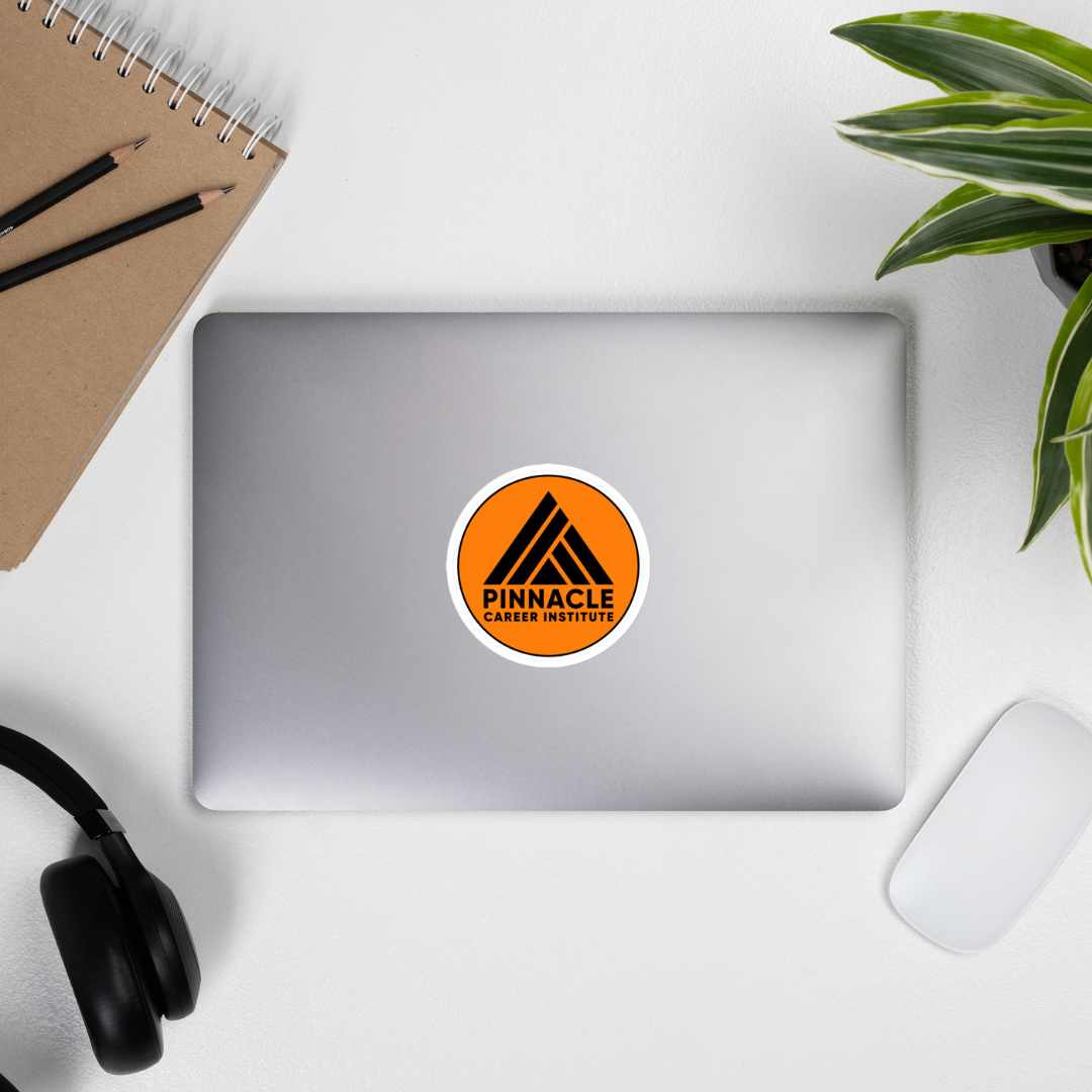 Laptop with round orange Pinnacle Career Institute Sticker Laptop with round orange Pinnacle Career Institute Sticker