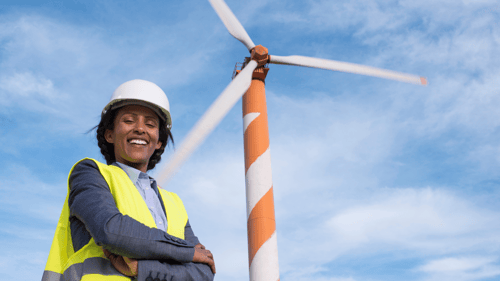 Wind site manager in front of turbine