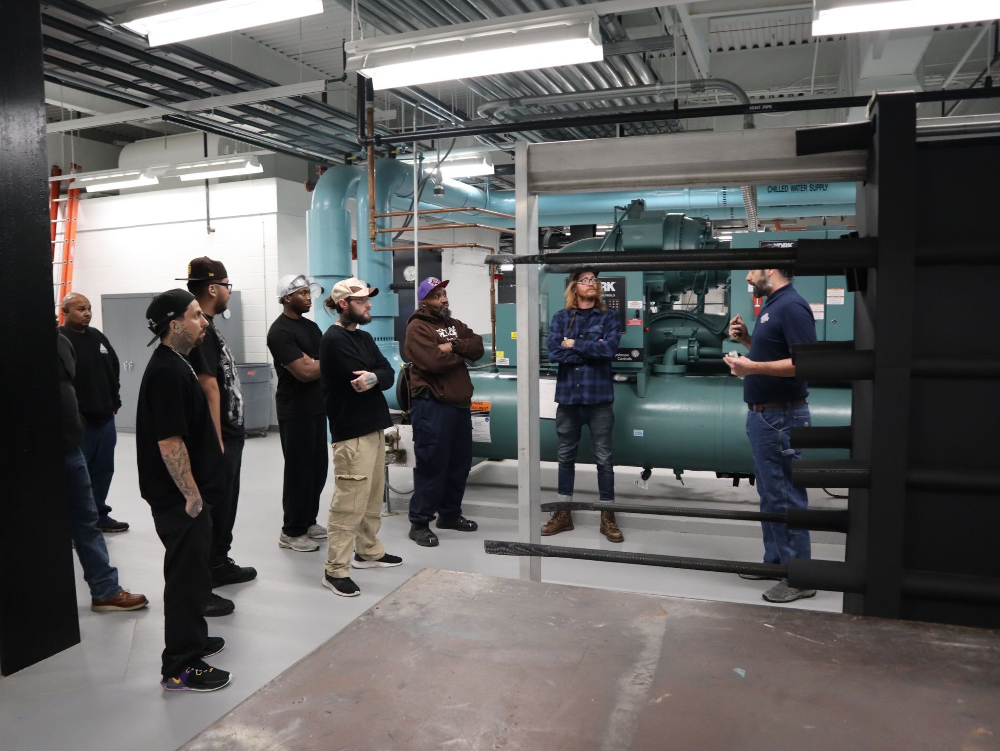 HVAC students touring campus facilities to see HVAC in action