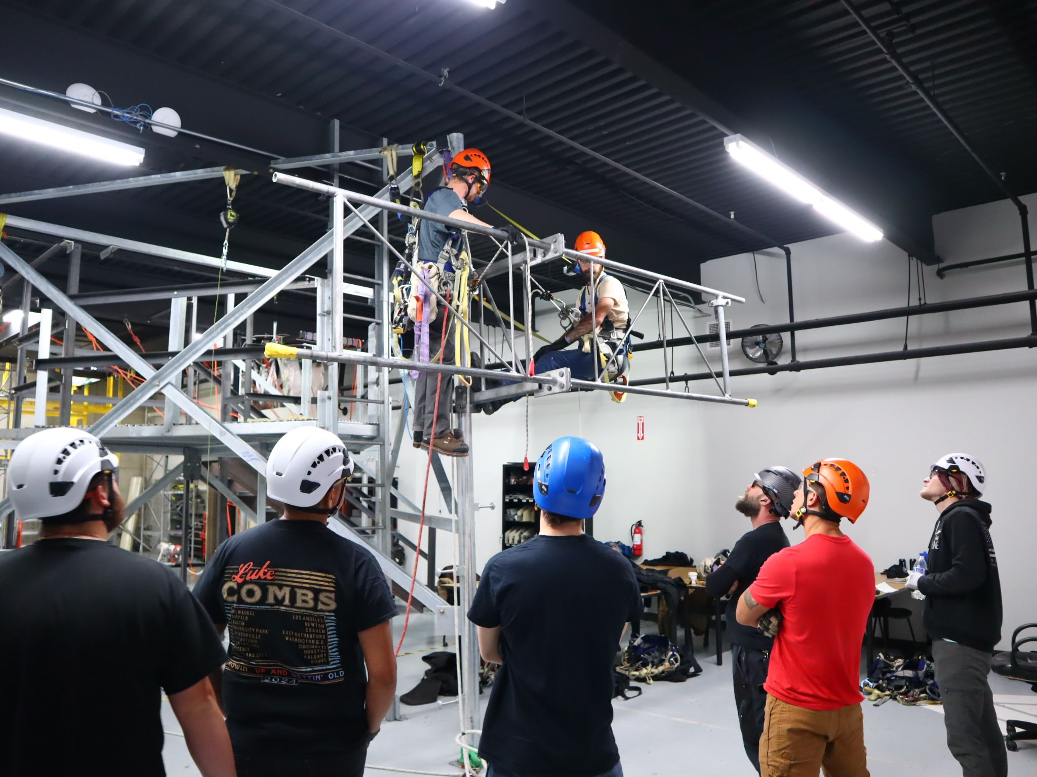 Tower Technician students practicing climbing techniques in the tower lab at Pinnacle Career Institute